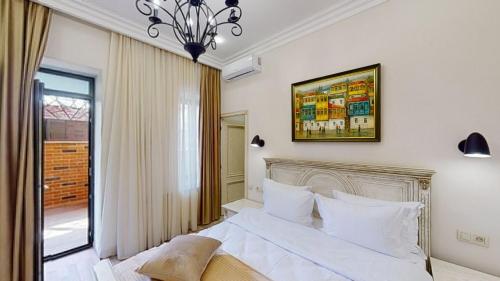 Ένα ή περισσότερα κρεβάτια σε δωμάτιο στο Aspar Boutique Hotel