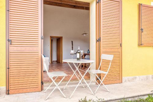a table and chairs sitting on a patio at Borgo del Faggio - Case Vacanza in Montepulciano
