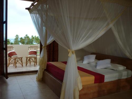 Ένα ή περισσότερα κρεβάτια σε δωμάτιο στο Kamili View Apartments