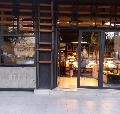 a store front with a person walking through the window at Centre two bedrooms apartment in Podgorica