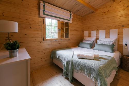 En eller flere senge i et værelse på Country Village Senses - Quinta Exclusiva