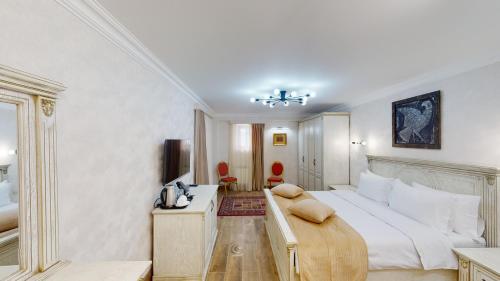 Ένα ή περισσότερα κρεβάτια σε δωμάτιο στο Aspar Boutique Hotel