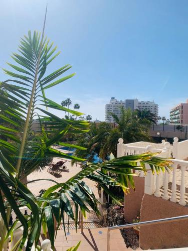 a view from the balcony of a building with palm trees at Ocean View Luxury Las Americas in Playa de las Americas