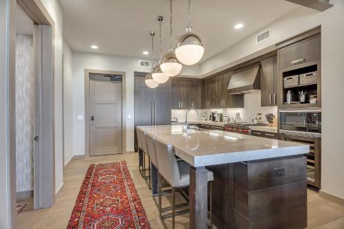 a kitchen with a large island with a counter top at Premium One Bedroom apartment hotel in Park City