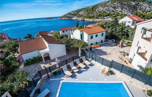an aerial view of a villa with a swimming pool at Vacation house with heated swimming pool 70 meters from the beach-Bobanac in Ražanj