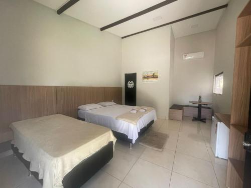 Ένα ή περισσότερα κρεβάτια σε δωμάτιο στο Hotel Fazenda Haras Paraíso do Atlântico