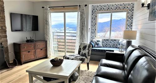 a living room with a couch and a table at Our Place in the Smokies in Gatlinburg