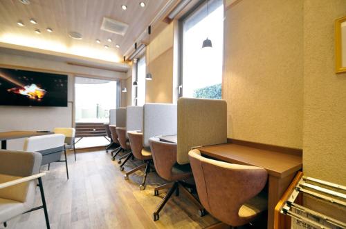 TV a/nebo společenská místnost v ubytování Annex Hotel Abe