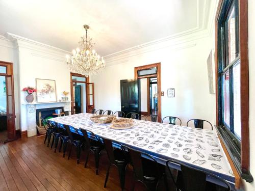 a dining room with a table and chairs at Linden Lodge in Linden