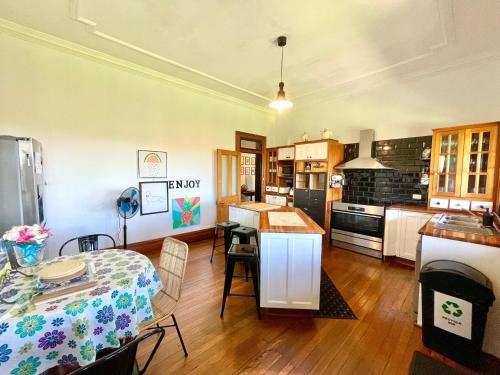 a kitchen with a table and a dining room at Linden Lodge in Linden