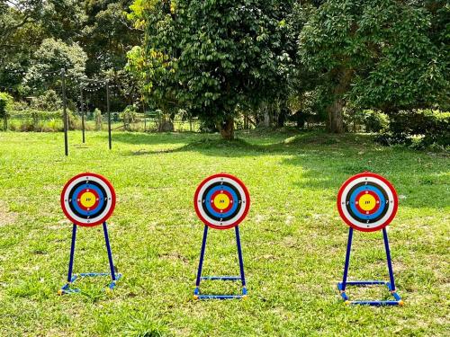 a group of targets sitting in the grass at PLAY at Lot 31 Eco Orchard Melaka in Sempang Sentul
