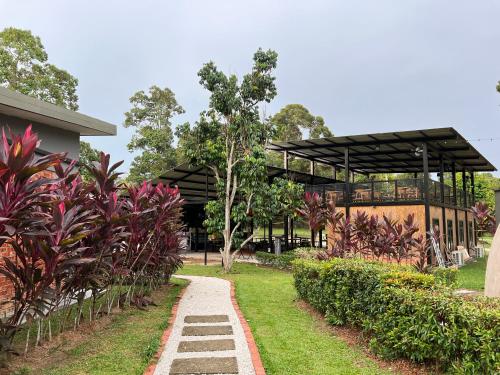 a building with a walkway in a park at PLAY at Lot 31 Eco Orchard Melaka in Sempang Sentul