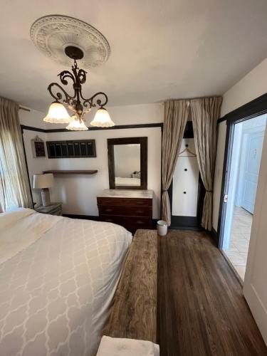 Кровать или кровати в номере Elle’s house