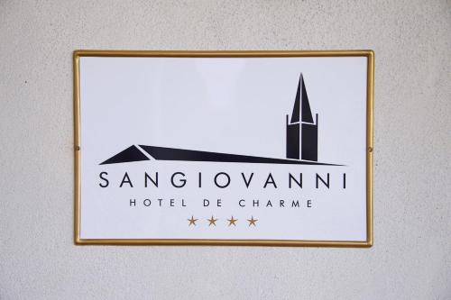 a sign for a hotel be chime on a wall at Hotel San Giovanni Resort in Saluzzo