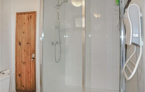 a bathroom with a shower with a glass door at Awesome Home In Fontevraud Labbaye With 1 Bedrooms And Wifi in Fontevraud-l'Abbaye