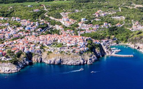 an aerial view of a town on a hill with the ocean at Vacation Home Kovachnica (Blacksmith`s shop) in Vrbnik