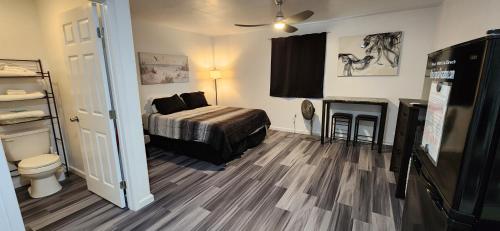 a small bedroom with a bed and a fireplace at #2 Cozy Vacation Hideaway Self CheckIn Studio Apt in Keaau