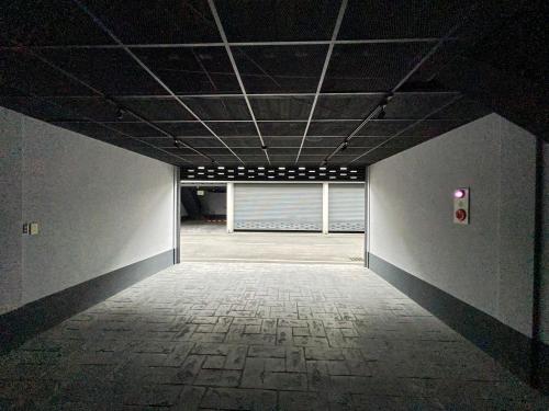 an empty hallway with a room with a window at MY Motel in Mingjian