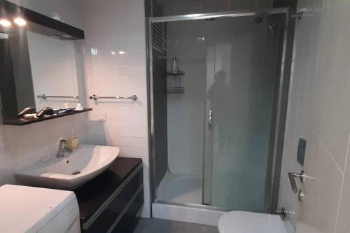 a bathroom with a shower and a sink and a toilet at Amazing view Large 1 bed 1 bath lovely apartment in Esenyurt