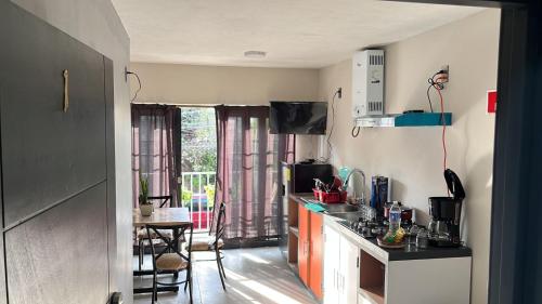 a kitchen with a sink and a counter top at SaVilie 1 - Seguridad y Comfort in Guadalajara