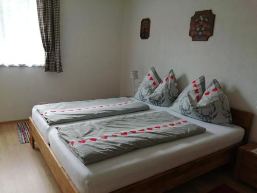 a bed with a cake on top of it at Ferienhaus Kitting in Lembach