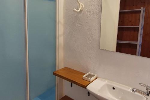 a bathroom with a sink and a mirror and a shower at Cal Curpets - Bicicletas FREE in Puigvert de Agramunt