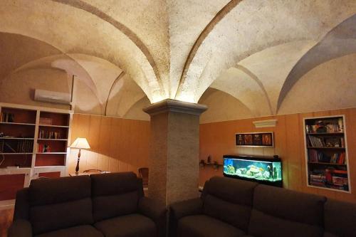a living room with a couch and a tv at Cal Curpets - Bicicletas FREE in Puigvert de Agramunt
