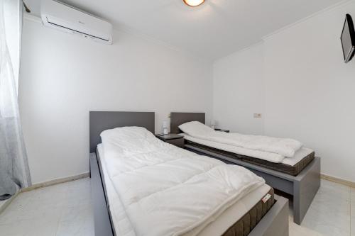A bed or beds in a room at La Mata 002-04