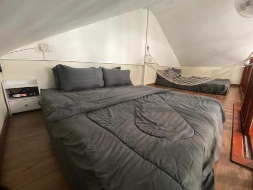 Postel nebo postele na pokoji v ubytování Amnis Tiny House