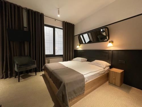 Una cama o camas en una habitación de Hotel 52
