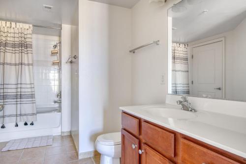 a bathroom with a sink and a tub and a toilet at Logan Circle 2BR w Gym WD Pool nr bars WDC-481 in Washington, D.C.