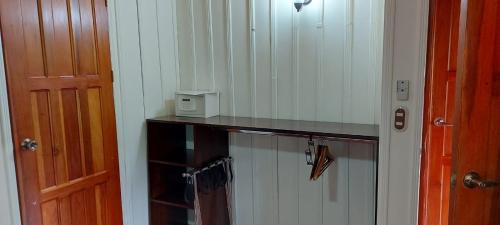 a room with a counter and a door and a room with a door at Casona Rústica & Bungalow in Fortuna
