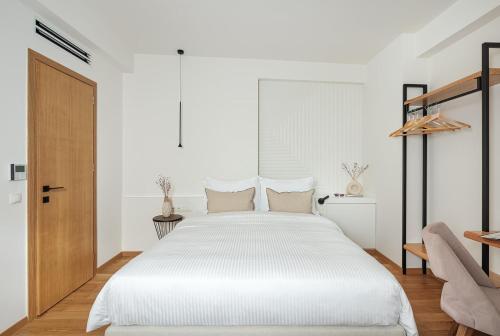 Postel nebo postele na pokoji v ubytování Petrou Suites