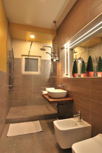 a bathroom with two sinks and a shower at Heritage Apartment at Berindey French Villa, City Center, Bucharest in Bucharest