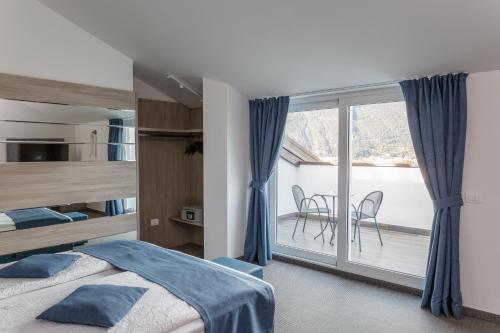 Postel nebo postele na pokoji v ubytování Hotel Benacus Panoramic