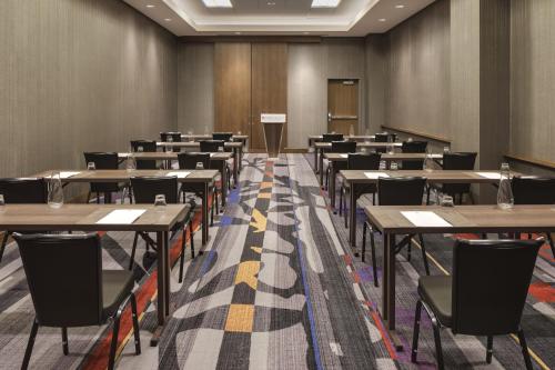 an empty lecture room with tables and chairs at Hyatt Regency Bloomington - Minneapolis in Bloomington