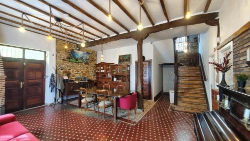 a living room with a table and a dining room at Hotel Tuul Etxea in Galdakao