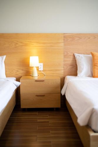Postel nebo postele na pokoji v ubytování Sline Hotel and Apartment