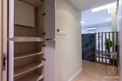 a walk in closet in a home with a staircase at The Aru Hotel at Aru Suites in Kota Kinabalu