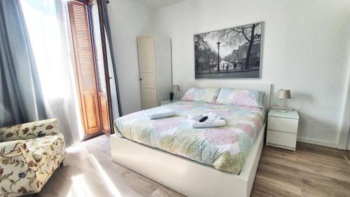 a bedroom with a bed with a stuffed animal on it at Hotel Tuul Etxea in Galdakao