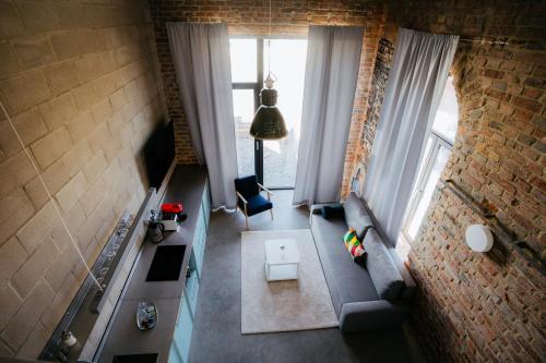 an overhead view of a living room with a couch and window at Smaltovňa Lofty in Lučenec