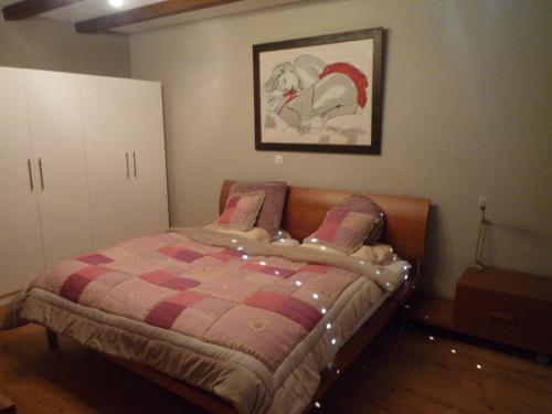 a bedroom with a bed and a cabinet at Chalet Mund in Mund