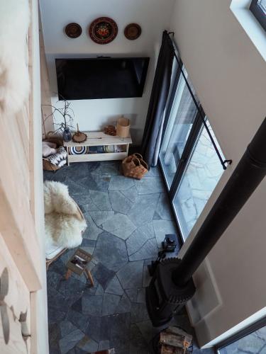 an overhead view of a living room with a television at Owczarnia Tatry in Bukowina Tatrzańska