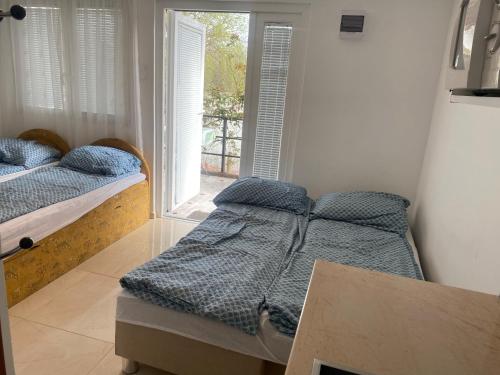 Postel nebo postele na pokoji v ubytování Aqua Bella Apartman