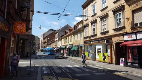 a city street with people walking on the street at Guest House Ilica2rooms in Zagreb