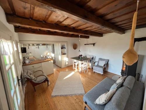 a living room with a couch and a table at Weingarten Lodge in Winten