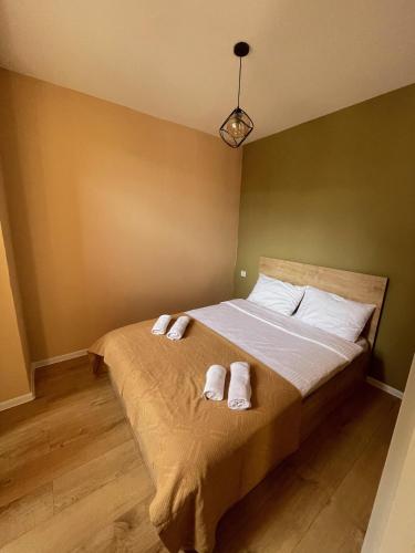 Säng eller sängar i ett rum på Tbilisi appartement