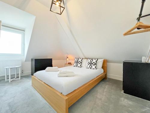 a bedroom with a large bed in a room at ENTR - Modern Apartments in Windsor in Windsor