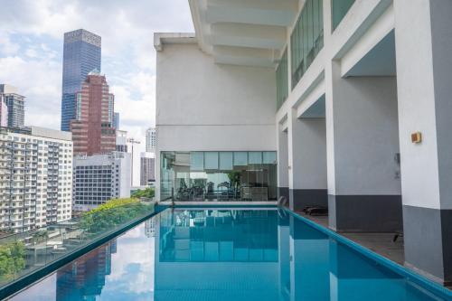 a swimming pool on the roof of a building at LILA SUITES ONE BUKIT CEYLON in Kuala Lumpur
