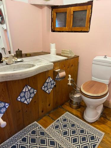 a bathroom with a toilet and a sink at Tuzla Yacht Club in Tuzla